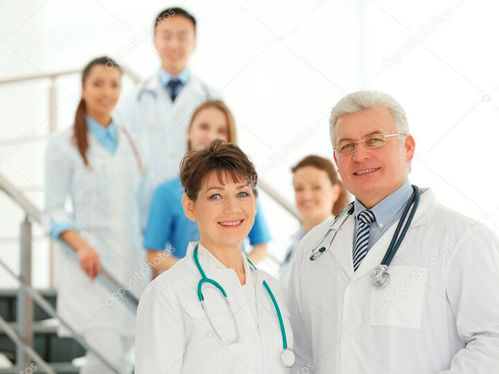 Depositphotos 102340466 Stock Photo Team Smiling Doctors Indoors